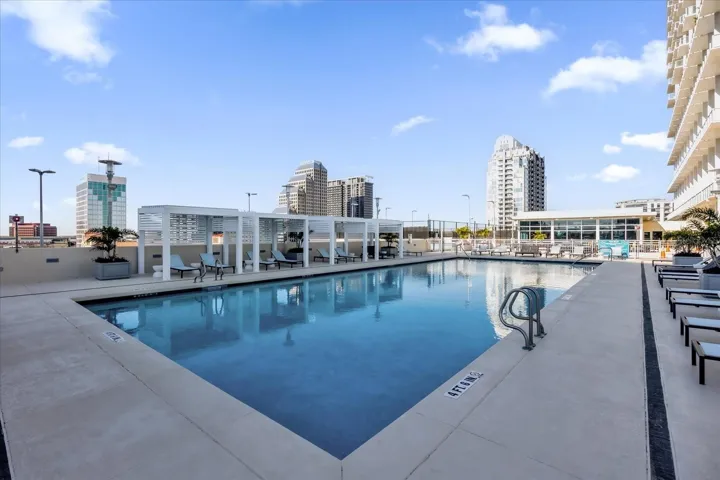 Resident pool with cabanas and city views.