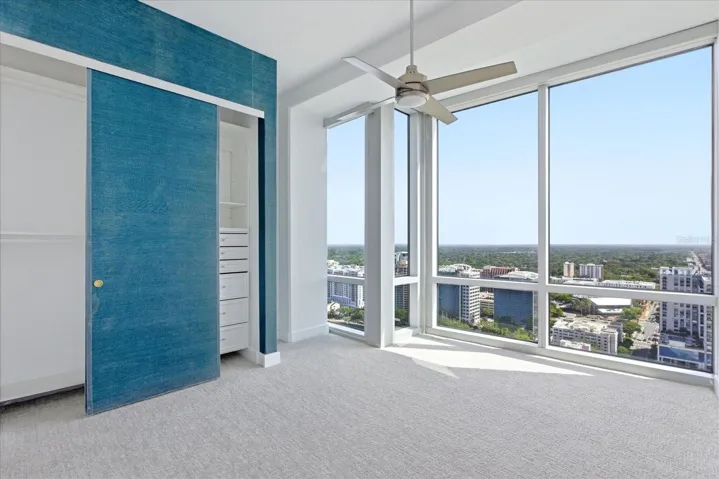 Bright south facing guest suite off front of entry.