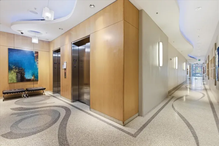 Resident elevator landing with 4 elevators to include one double size move in move out elevator.