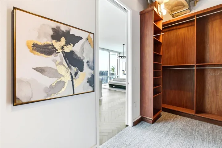 Exceptionally well laid out walk in-closet with new carpeting underfoot, and easy flow back to the primary suite - offering immediate functionality and long term design potential.
