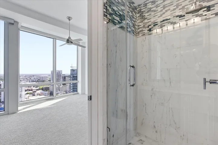 En-suite bath within the bedroom, glass-enclosed shower and a practical, well-defined layout.