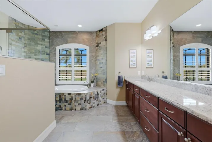 The primary bath has it all walk in shower, soaking tub, dual vanity separate toilet with a privacy door