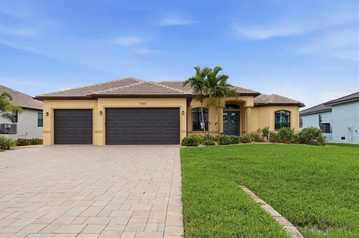 3 car paver garage with oversized driveway