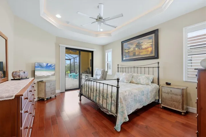 Primary Bedroom with a view of the canal and pool