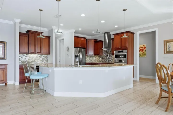 Chef’s dream kitchen with breakfast bar dining