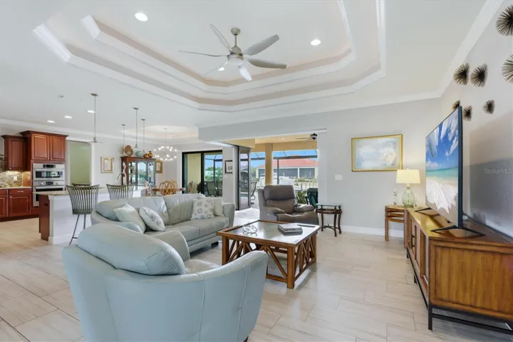 Lighted tray ceilings Home opens to lanai with zero corner impact sliders