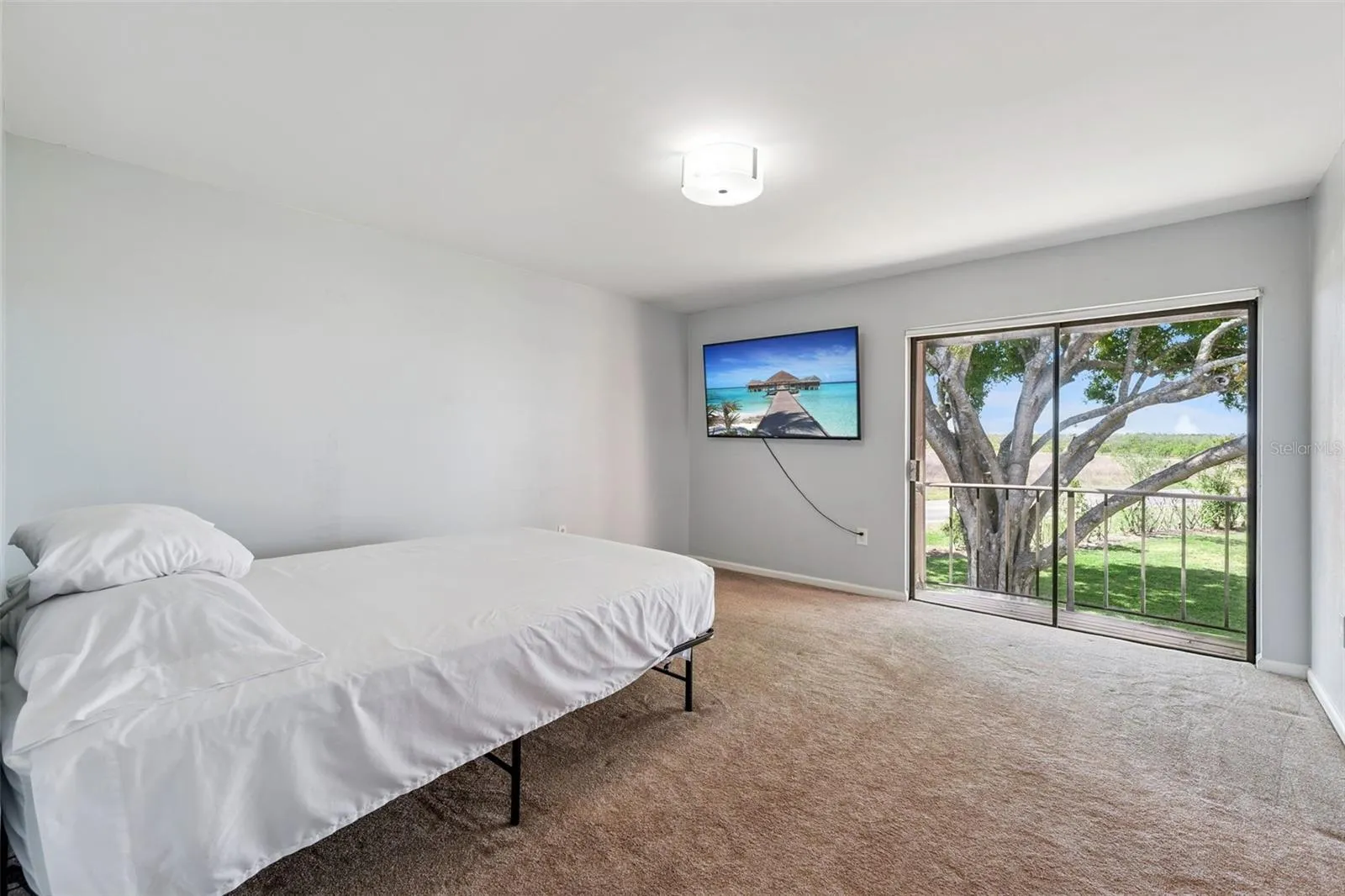 Primary bedroom with view of grounds