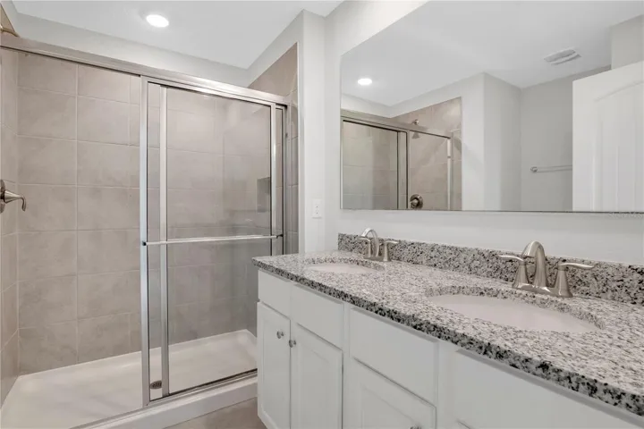 Private primary bathroom with functional layout
