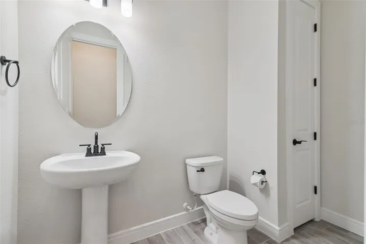 1/2 bath that has lots of extra storage.