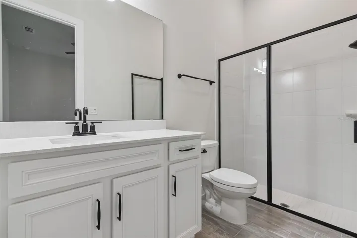en-suite bath in the second bedroom near the garage.  Great spot for guests
