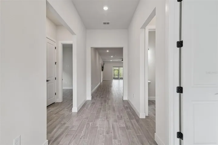 Step inside this home to eleven-foot ceilings and ceramic tile flooring throughout.   Enjoy conservation views out back that will never be built on.