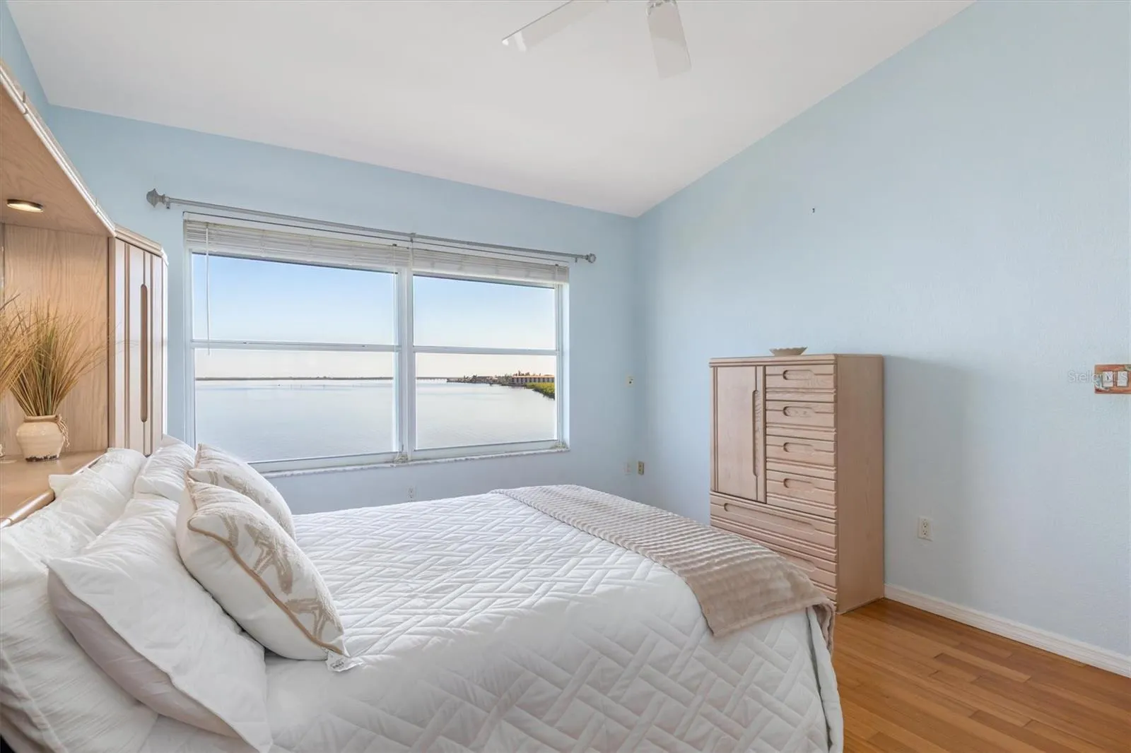 Primary Bedroom with spectacular views of the Peace River. Ensuite bath and walk-in closet.