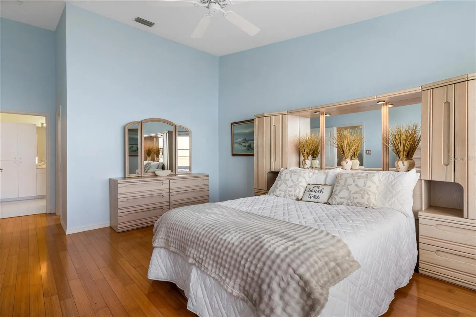 Primary bedroom with access to walk-in closet and ensuite bath