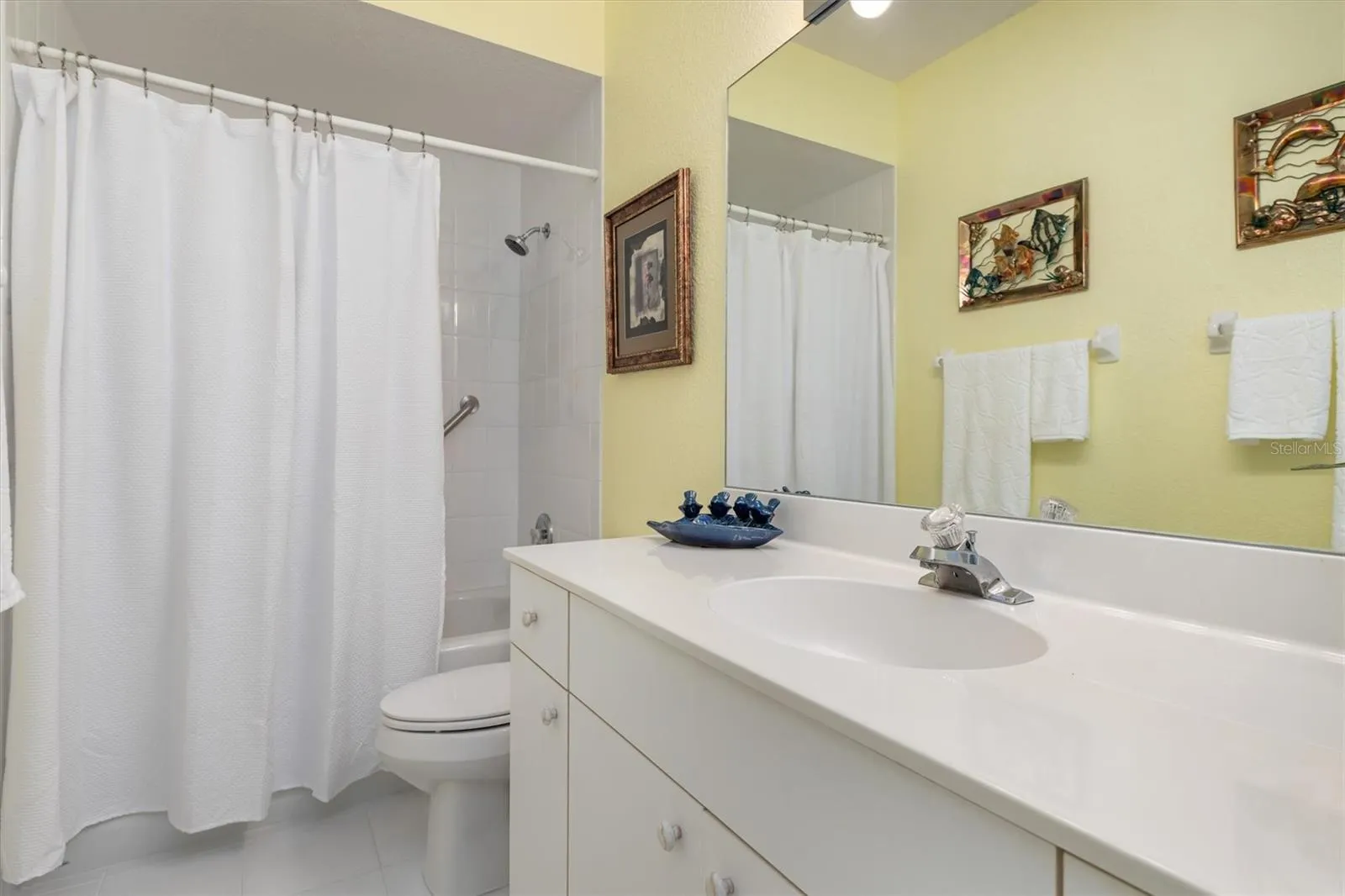 Guest bathroom with tub/shower combination.