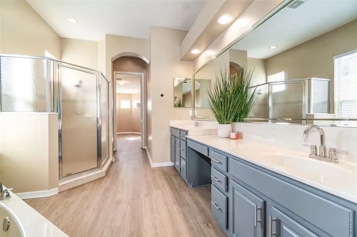 Primary Bath with Dual Sinks, Garden Tub, Walk-in Shower, and Oversized Walk-In Closet