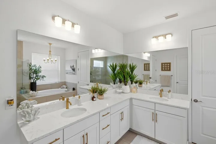 A lavish spa-like ensuite bathroom in the primary bedroom