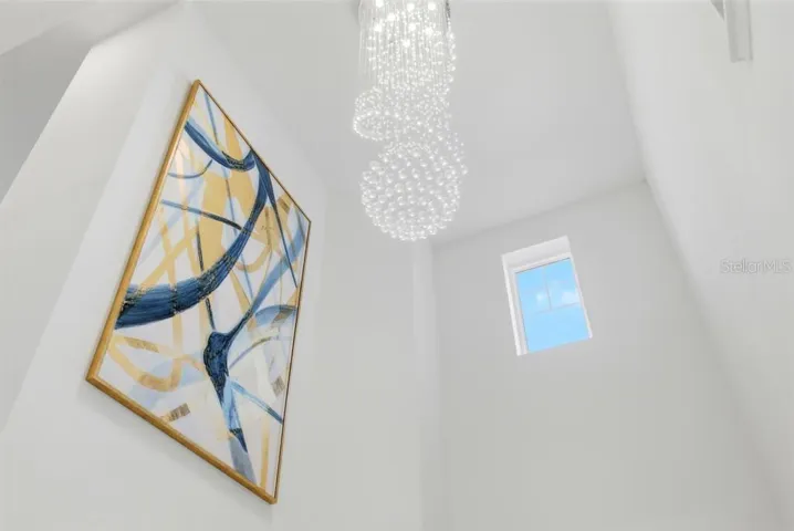 luxurious/elegant Foyer with this stunning chandelier