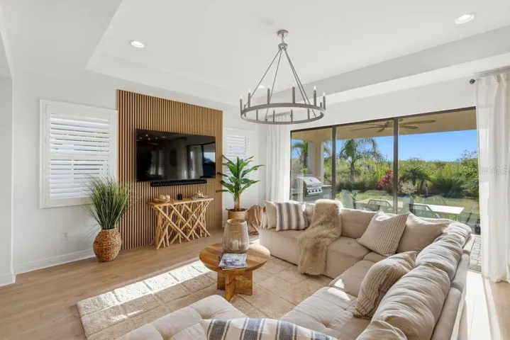 Living room with decorative wall panelling and beautiful views of the preserve