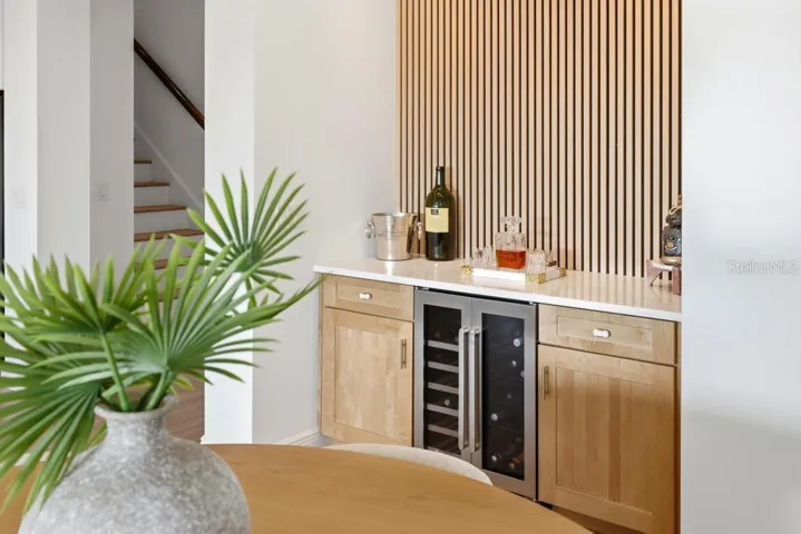 Custom Dry Bar with built-in wine fridge and wine racks