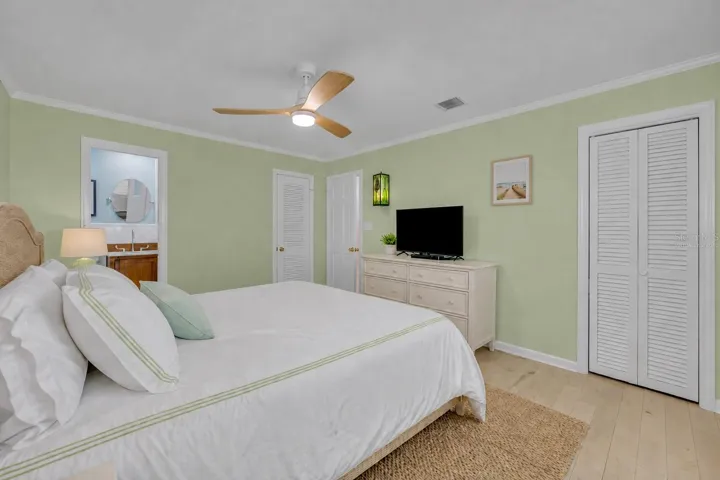 Primary bedroom with coastal vibes - Virtually Staged