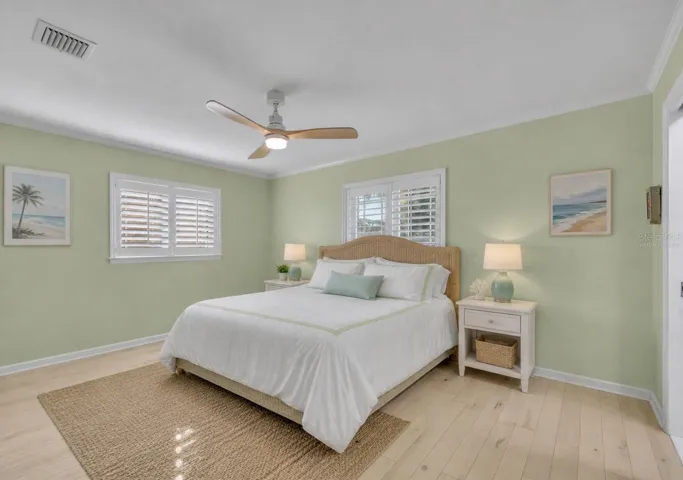 Primary bedroom with coastal vibes - Virtually Staged