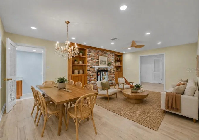 Formal living and dining room with pocket doors for privacy - Virtually Staged