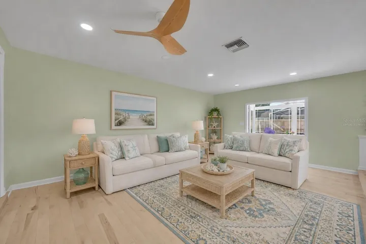 Family room with French doors to the Florida room - Virtually Staged