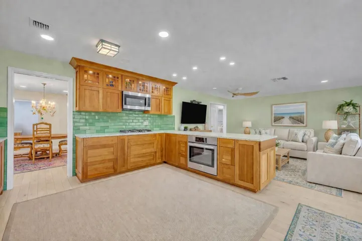 Updated kitchen overlooking family room - Virtually Staged