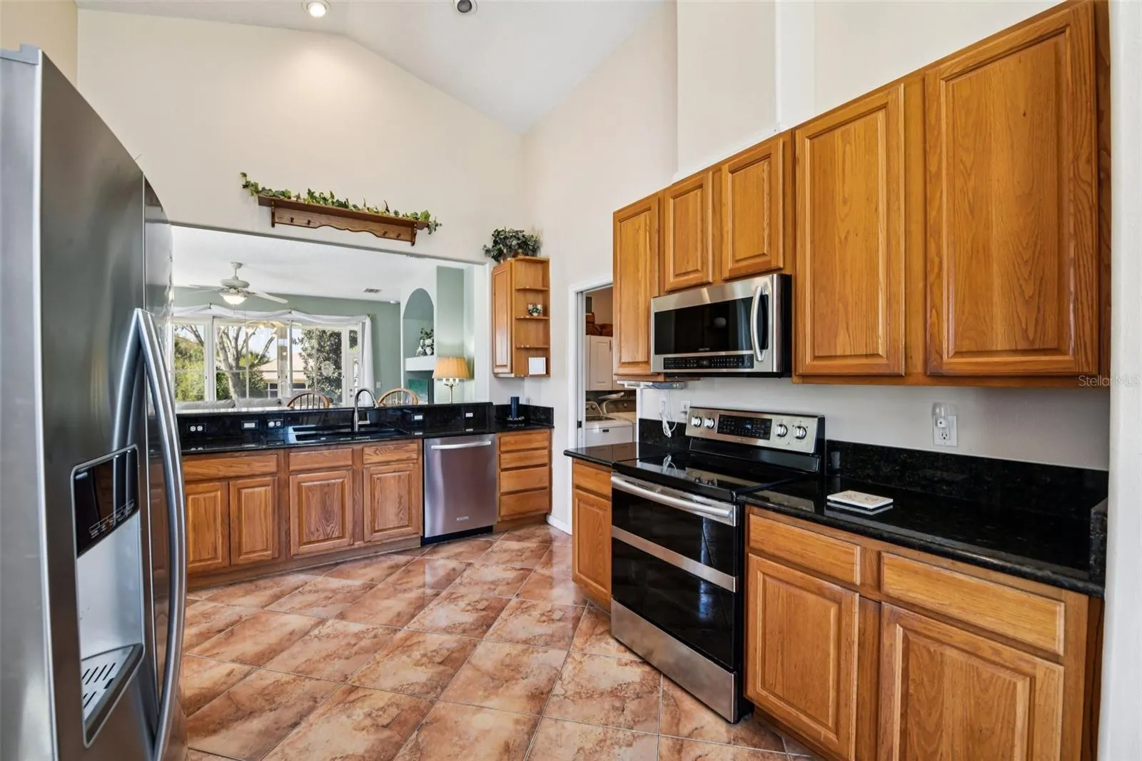 High Ceiling, 42 in wood cabinets and granite counter tops.