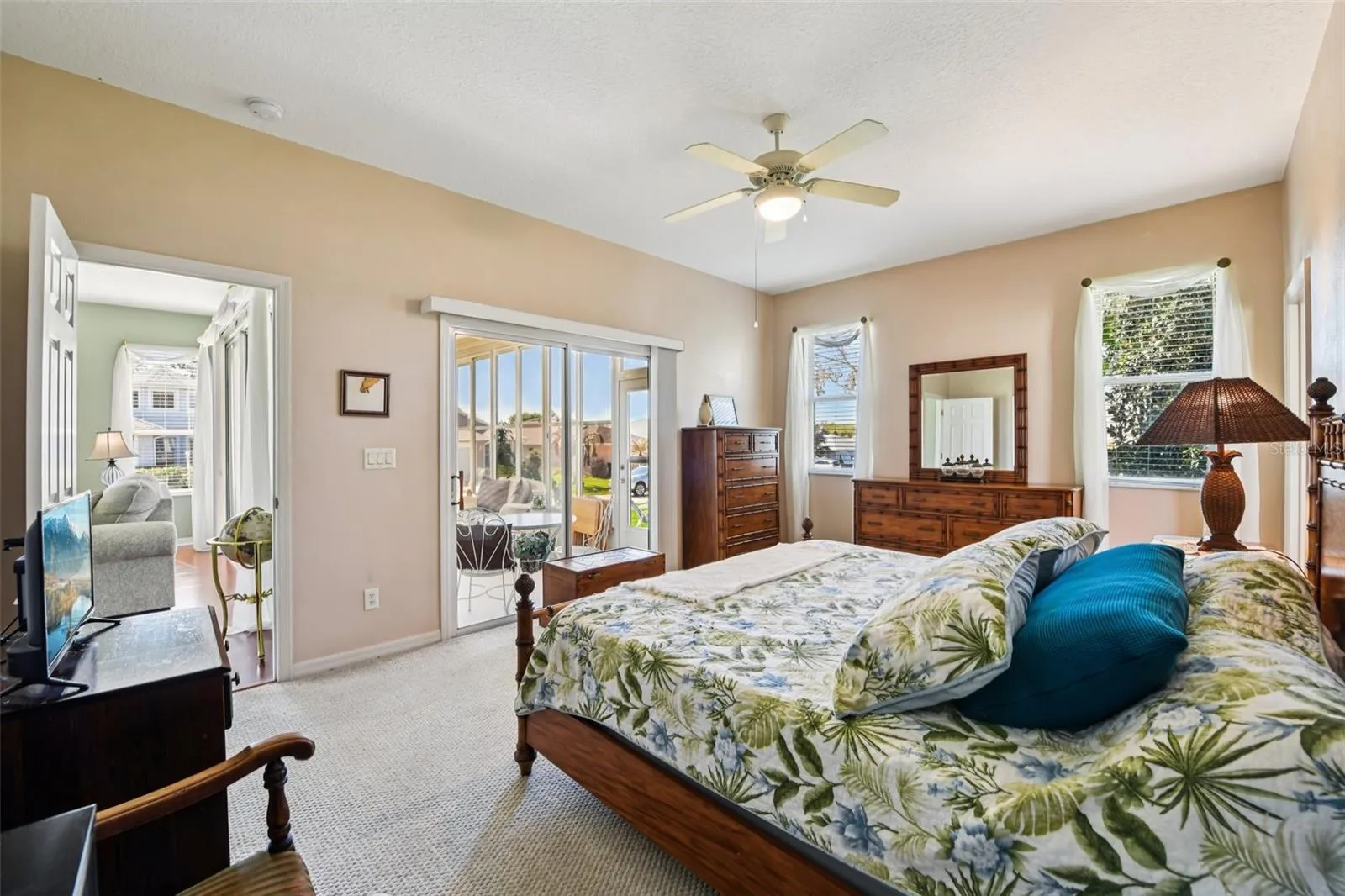 Primary Suite with relaxing view of all weather room.