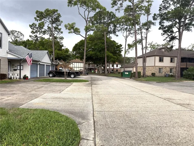 View of the Clubhouse, Pool and all Amenities from the Condo front door. The Clubhouse is in the center of the photo...just a one minute walk to the pool from this home!