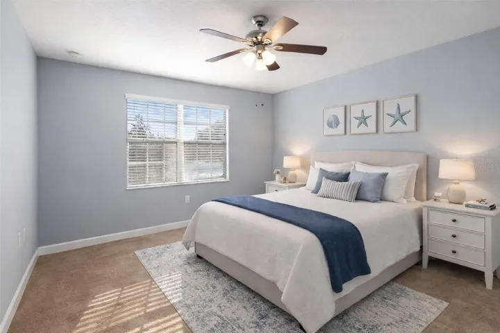 BEDROOM 2 with SERENE WATER VIEWS and ABUNDANT NATURAL LIGHT.