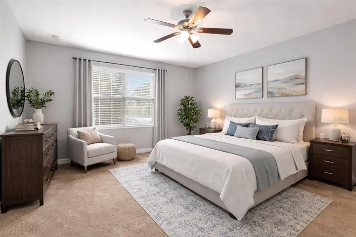 FIRST-FLOOR PRIMARY SUITE with WATER VIEWS and ABUNDANT NATURAL LIGHT.
