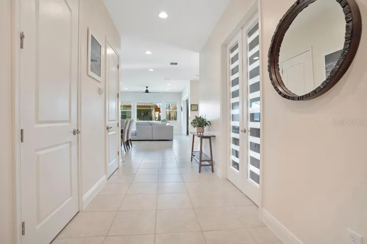 Step inside to discover a bright OPEN-CONCEPT FLOOR PLAN where the Living Room, Dining area, and Kitchen flow seamlessly together, all enhanced by sleek tile flooring throughout the main level.