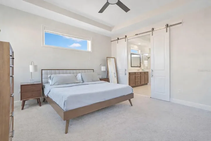Upstairs, retreat to your LUXURIOUS Primary Suite, complete with tray ceilings and CHIC BARN DOORS that lead into a SPA-INSPIRED EN SUITE BATH and walk-in closet.