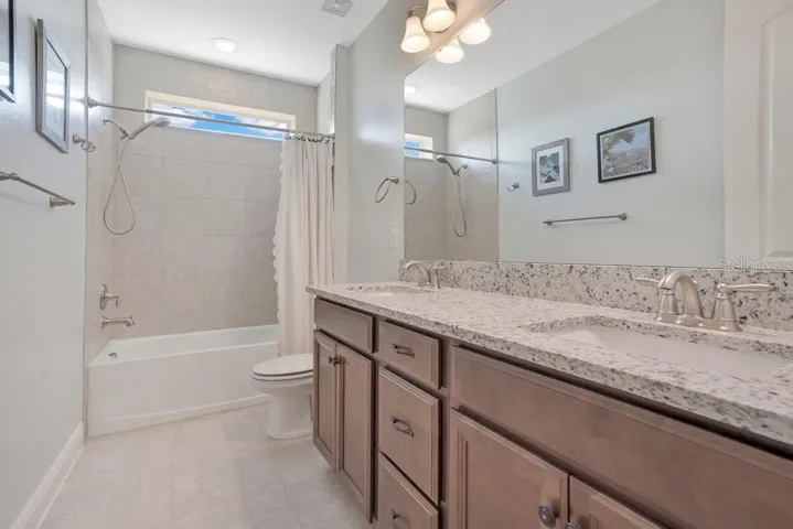 A beautifully appointed full bath serves the upstairs secondary Bedrooms.