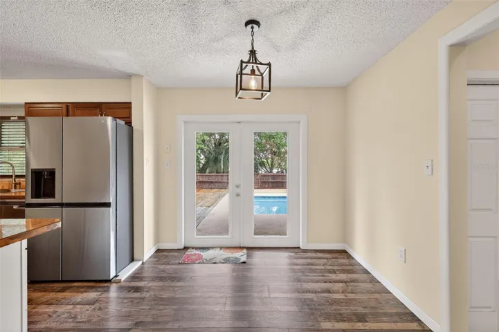 Dining area with view of pool area.