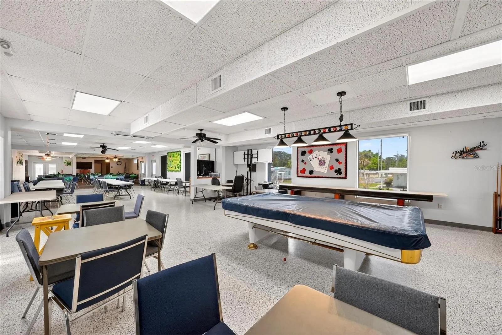 Clubhouse with pool table and shuffle board table