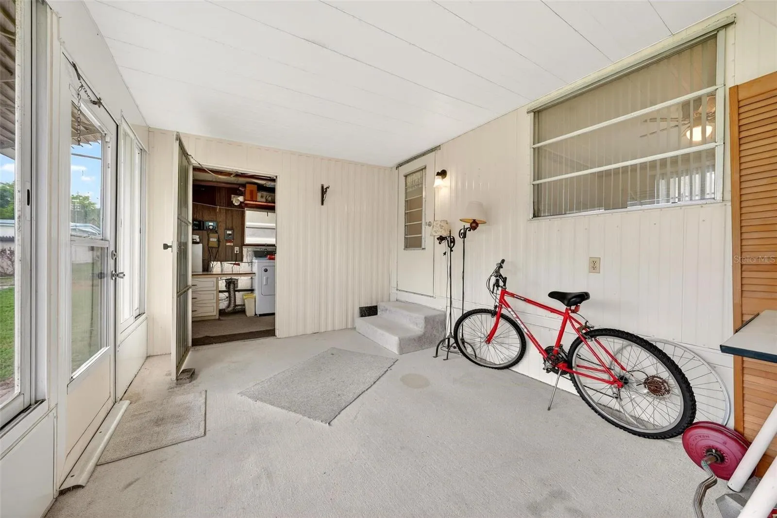 Enclosed rear porch with attached laundry room