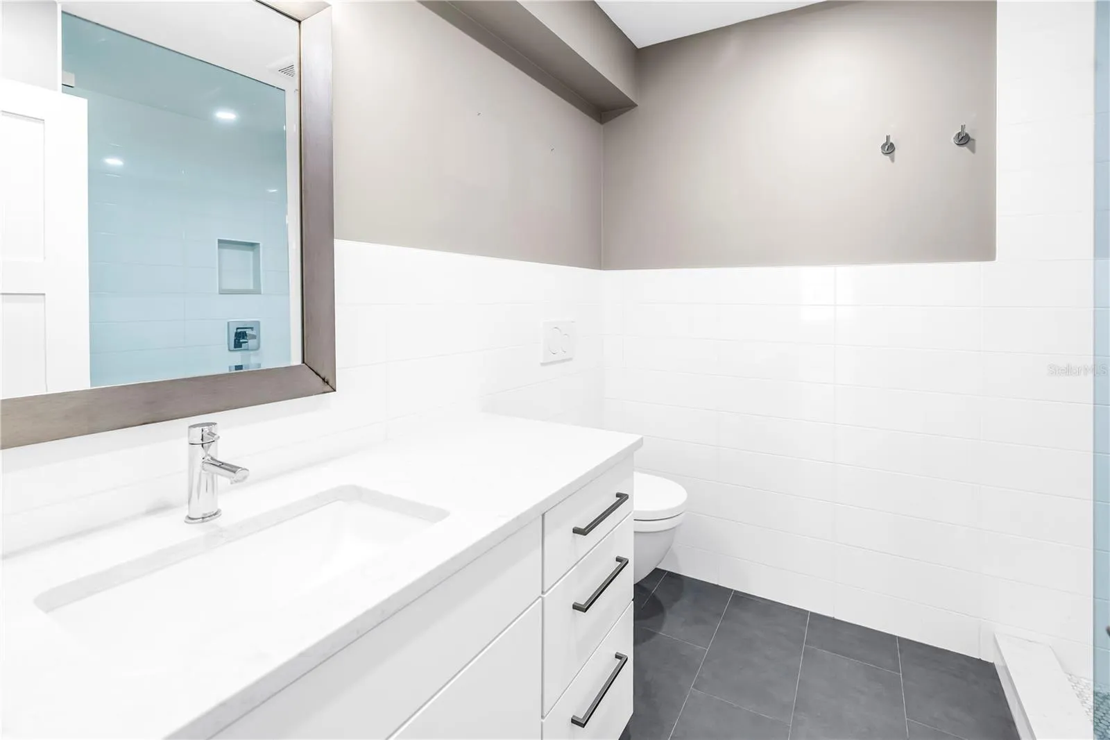 Full Bath 2 fully updated with modern wall mount toilet and glass Shower