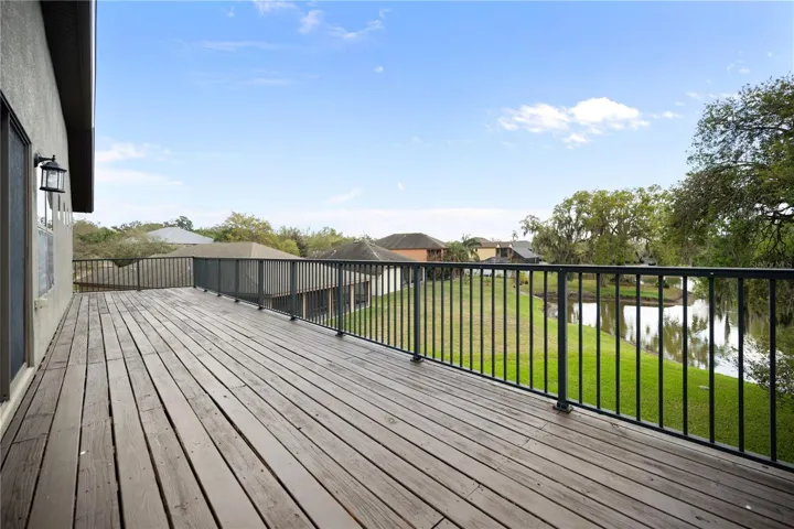 Upper level Open DECK just off of the Game room for entertaining and watching the SUNSET over the Bird Santuary!