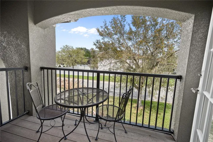 French doors lead to the Front Balcony off of the Guest Bedroom #1