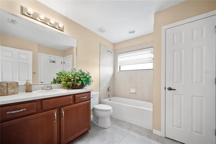 Guest Bathroom #2 connected to the Ensuite 2nd Master Bedroom/ Guest Bedroom #3, plus  Large Linen Closet storage.