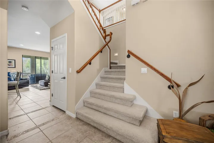 Winding Staircase leads to the EXPANSIVE upstairs !!