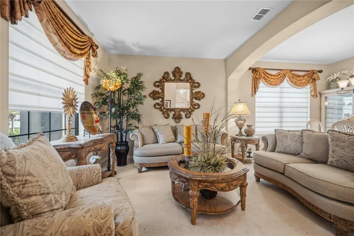 Gorgeous Formal Living room greets you on the left as you enter