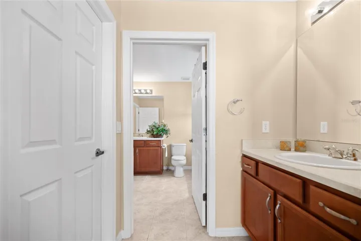 Dutch Vanity  in the Upstairs Guest Suite to the right , Walk- In Closet to the left, full 3 piece bathroom straight ahead.