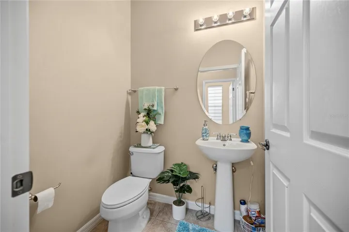 Half Bathroom downstairs is located  near the front entry hall  and Garage access.