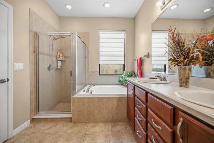 Shower & Tub area In Primary ENSUITE Bed/ Bathroom features a Huge walk in Closet Storage!!