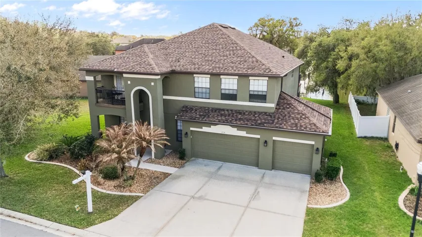 Aerial Front View Showing off the Triple wide Parking area & this GRAND Elevation!