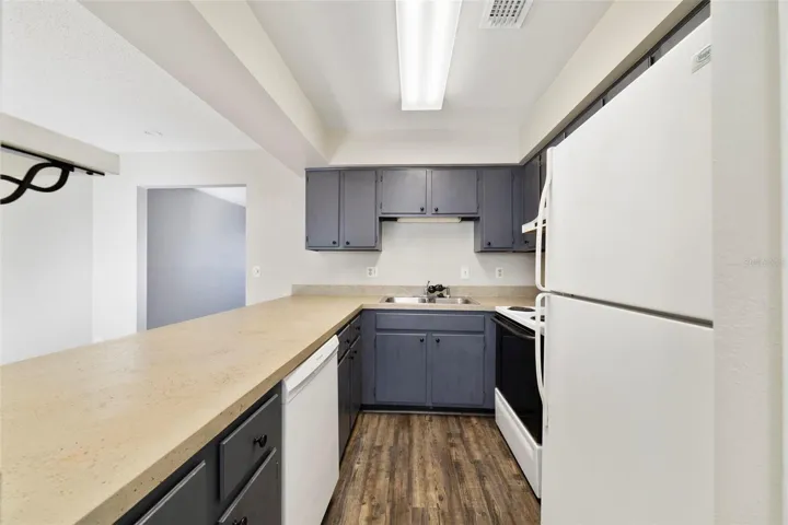 The Kitchen offers plenty of cabinetry and counter space, a CONVENIENT CLOSET PANTRY, and a breakfast bar perfect for casual meals or morning coffee.